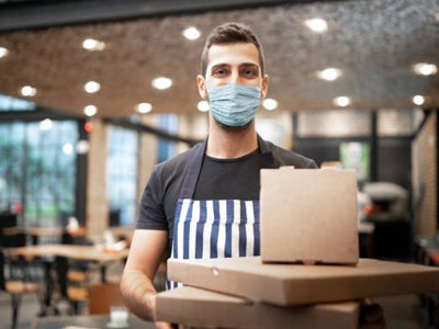 Courier holding parcels ready for delivery